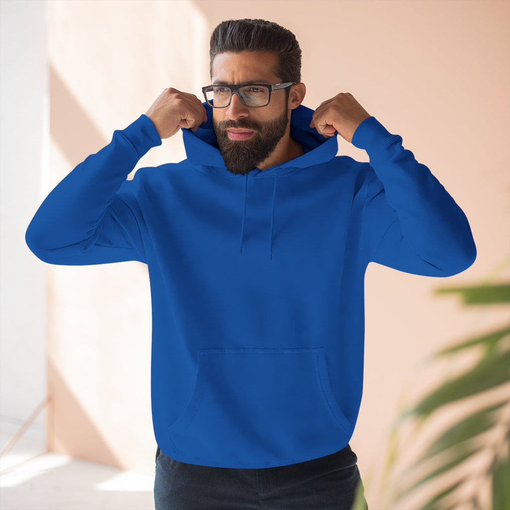 Man wearing a blue hoodie with a neutral background