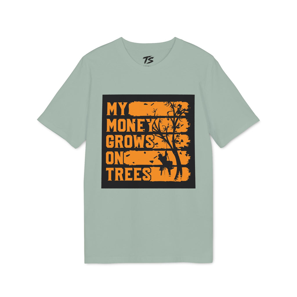 A sage green short-sleeve t-shirt with a graphic print on the front. The graphic features a black rectangular background with distressed orange text reading 'MY MONEY GROWS ON TREES' and a black tree silhouette.