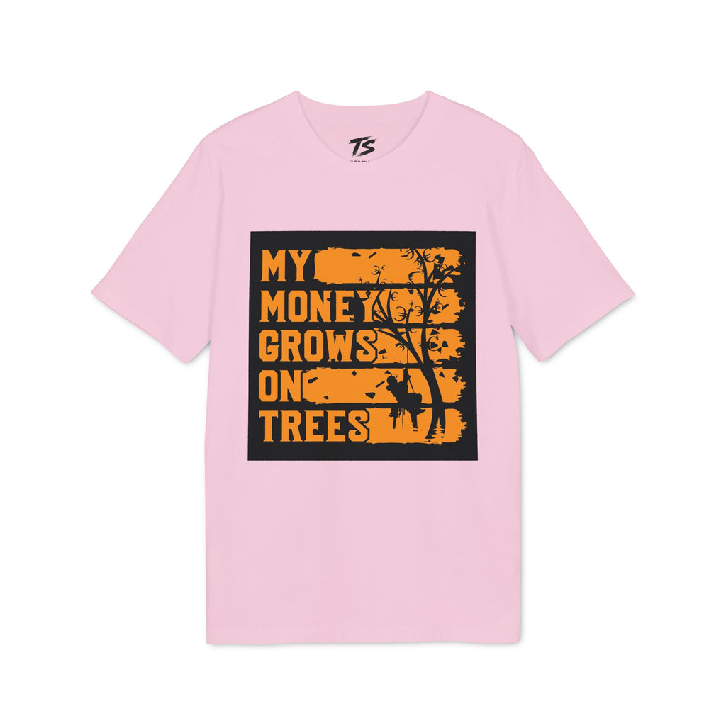 A light pink short-sleeve t-shirt with a black rectangular graphic on the chest featuring the text 'MY MONEY GROWS ON TREES' in orange lettering with a tree silhouette.